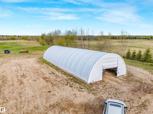 Long, white fabric-covered arch structure with a large open entrance - 57016 Range Road 13, Rural Barrhead County, AB - Outdoor