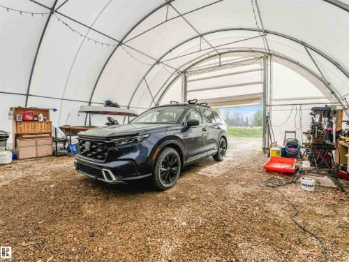 Image quality insufficient for description - 57016 Range Road 13, Rural Barrhead County, AB - Indoor Photo Showing Garage