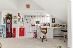 Kitchenette featuring white cabinetry, a white refrigerator, a white range, and a white dishwasher - 