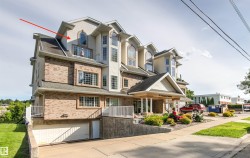 Multi-level building with mixed siding and brick exterior - 