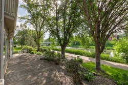 Expansive wood-finish deck with direct outdoor access - 