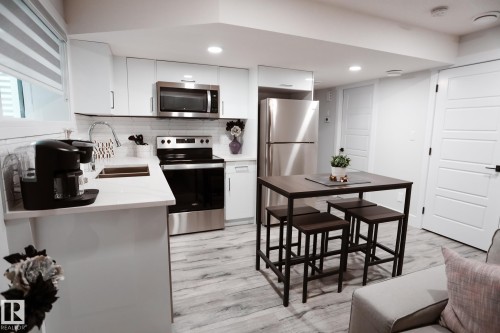 #Bsmt 7449 Chivers Cr Sw, Edmonton, AB - Indoor Photo Showing Kitchen With Stainless Steel Kitchen With Double Sink