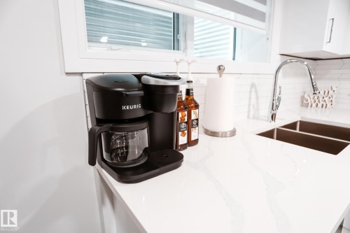 #Bsmt 7449 Chivers Cr Sw, Edmonton, AB - Indoor Photo Showing Kitchen With Double Sink