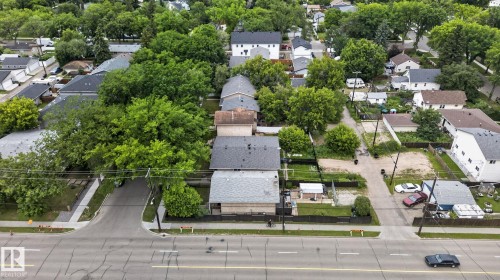 Aerial perspective of a residential neighborhood featuring established homes with varying rooflines - 12703 122 Street Nw, Edmonton, AB 