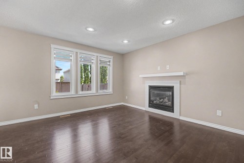 9507 Simpson Crest, Edmonton, AB - Indoor Photo Showing Living Room With Fireplace