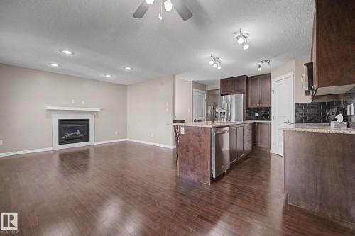 9507 Simpson Crest, Edmonton, AB - Indoor Photo Showing Kitchen With Fireplace