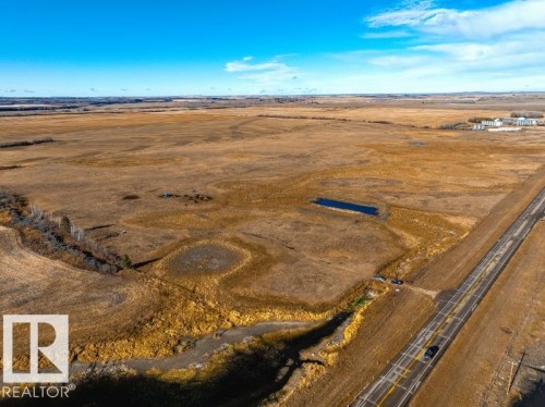 Expansive open acreage featuring varied terrain and natural water features - 0 Ne-3-56-12-W4 Northeast, Rural Two Hills County, AB 