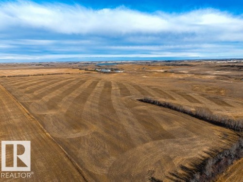 Expansive agricultural land featuring cultivated fields with distinct planting patterns - 0 Ne-3-56-12-W4 Northeast, Rural Two Hills County, AB 