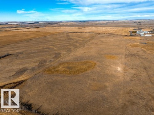 Expansive agricultural land featuring a wide-open terrain and visible crop patterns - 0 Ne-3-56-12-W4 Northeast, Rural Two Hills County, AB 
