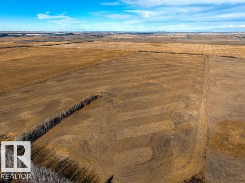 Expansive agricultural acreage featuring cultivated fields and a treeline - 0 Ne-3-56-12-W4 Northeast, Rural Two Hills County, AB 