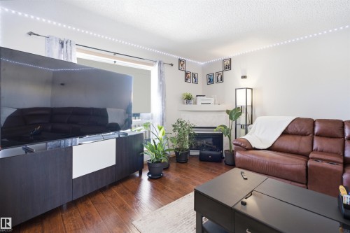#71 10909 106 St Nw, Edmonton, AB - Indoor Photo Showing Living Room With Fireplace