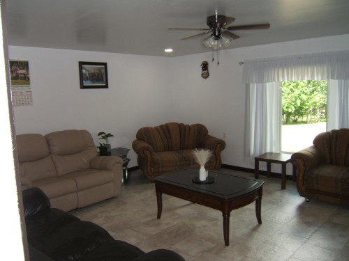 Living area featuring light-toned tile flooring, recessed ceiling lighting, and a ceiling fan with integrated light fixture - 543016 Rng Rd 122, Rural Two Hills County, AB - Indoor Photo Showing Living Room