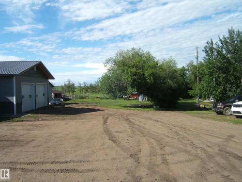 Detached two-door garage with metal roof and light gray siding - 543016 Rng Rd 122, Rural Two Hills County, AB - Outdoor
