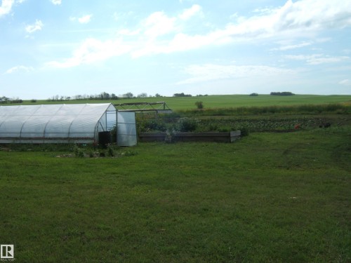 Agricultural greenhouse with a clear plastic cover and metal frame - 543016 Rng Rd 122, Rural Two Hills County, AB - Outdoor With View