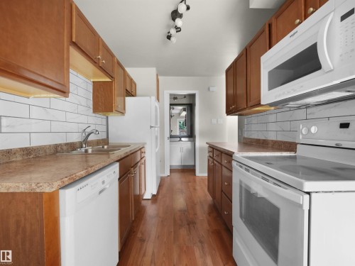 #B 16405 89 Av Nw, Edmonton, AB - Indoor Photo Showing Kitchen With Double Sink