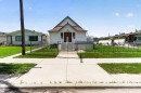 Gabled facade with white siding and a brown shingle roof - 13156 101 St Nw, Edmonton, AB 