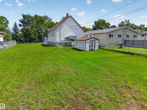 Spacious rear yard with a prominent storage shed - 13156 101 St Nw, Edmonton, AB 