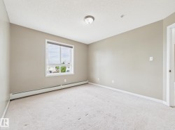 Neutral-toned walls complement the light-colored carpet flooring - 