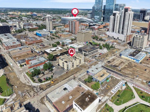High-rise building with a prominent central location, surrounded by diverse urban architecture and infrastructure - #207 10606 102 Av Nw, Edmonton, AB 