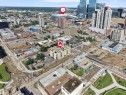 High-rise building with a prominent central location, surrounded by diverse urban architecture and infrastructure - #207 10606 102 Av Nw, Edmonton, AB 