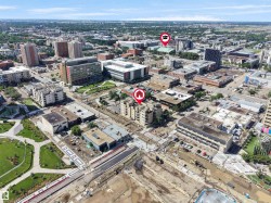 Urban aerial perspective showcasing a multi-story building within a dense city environment - 