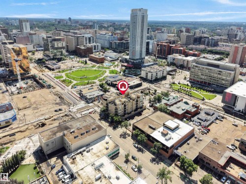 Aerial perspective showcasing a dense urban environment with a mix of commercial and residential structures - #207 10606 102 Av Nw, Edmonton, AB 