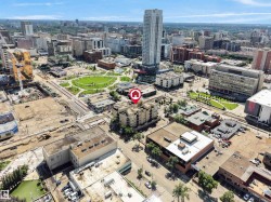 Aerial perspective showcasing a dense urban environment with a mix of commercial and residential structures - 