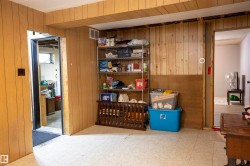 Paneling walls with an exposed ceiling beam and patterned tile flooring - 
