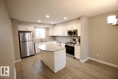 208 Allard Way, Fort Saskatchewan, AB - Indoor Photo Showing Kitchen With Double Sink