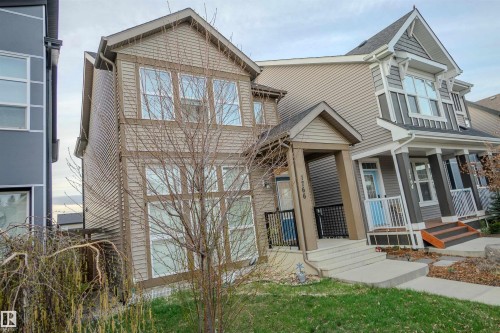 Two-story property with light brown siding and a gabled roof - 1766 Dumont Crescent Sw, Edmonton, AB 