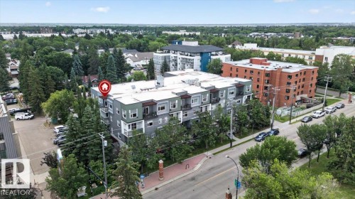 Modern multi-story residential building with a contemporary design and a flat roofline - #406 8525 91 St Nw, Edmonton, AB 