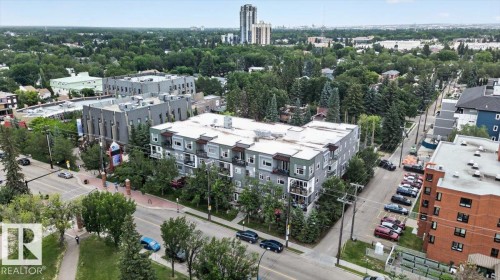Modern multi-story building featuring balconies and a flat roofline - #406 8525 91 St Nw, Edmonton, AB 