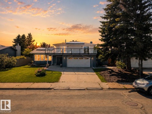 Contemporary exterior with a second-story balcony featuring a glass railing - 5212 142 Street Nw, Edmonton, AB - Outdoor