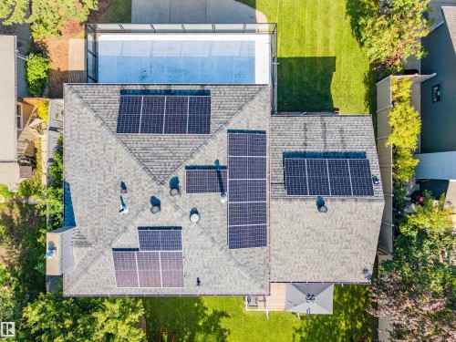 Asphalt shingle roof featuring multiple solar panel arrays - 5212 142 Street Nw, Edmonton, AB - Outdoor