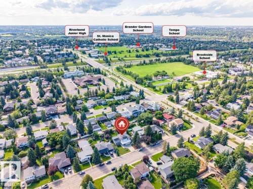 Aerial perspective showcasing the property within a residential neighborhood featuring mature trees and established homes - 5212 142 Street Nw, Edmonton, AB - Outdoor With View