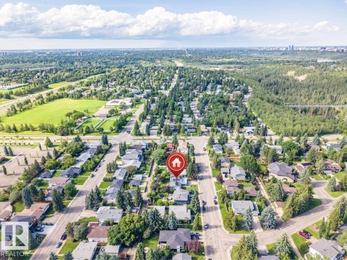 Residential neighborhood featuring mature trees and street-lined properties - 5212 142 Street Nw, Edmonton, AB - Outdoor With View