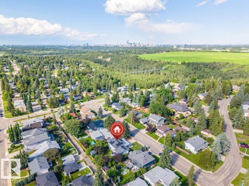 Aerial perspective showcasing a residential neighborhood with varied architectural styles and mature trees - 5212 142 Street Nw, Edmonton, AB - Outdoor With View