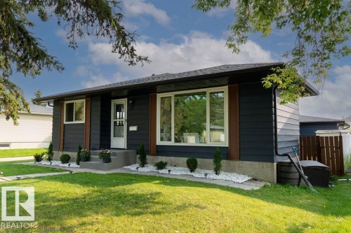 Contemporary single-story exterior with horizontal dark siding - 27 Apache Crescent, Leduc, AB 
