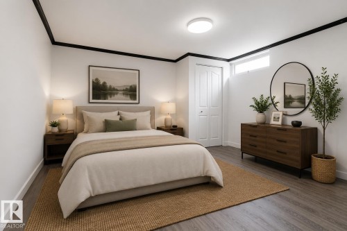 Bedroom featuring grey wood-finish flooring, white walls with black trim, and a high transom window - 27 Apache Crescent, Leduc, AB 