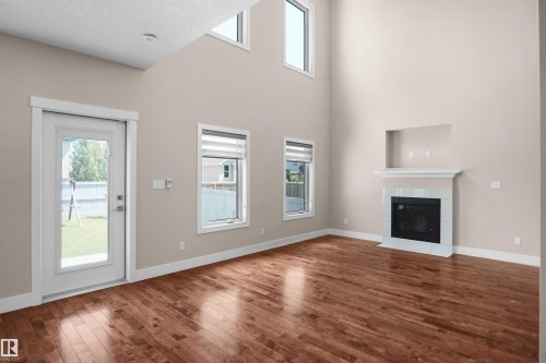 16539 132 Street Nw, Edmonton, AB - Indoor Photo Showing Other Room With Fireplace