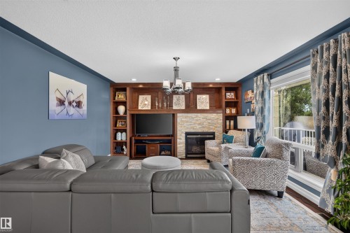 1751 Haswell Cove Nw, Edmonton, AB - Indoor Photo Showing Living Room With Fireplace