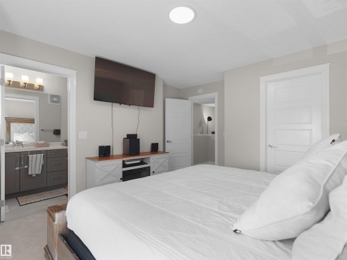 Light-toned walls complement a contemporary ceiling-mounted light fixture - #30 4137 76 St Nw, Edmonton, AB 