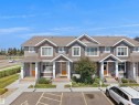Multi-unit dwelling featuring light brown siding and white trim - #30 4137 76 St Nw, Edmonton, AB 