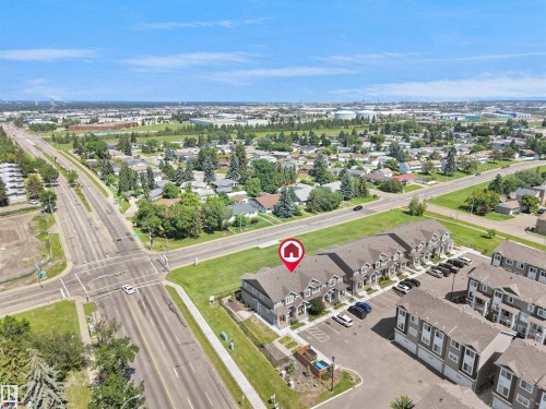 Aerial perspective showcasing a multi-unit residential development with ample surface parking - #30 4137 76 St Nw, Edmonton, AB 