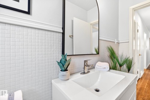 Bathroom vanity featuring a white sink basin and chrome faucet - 16152 110B Avenue Nw, Edmonton, AB - Indoor Photo Showing Bathroom