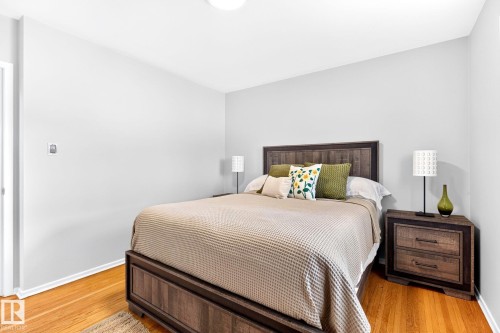 Wood-finish flooring throughout - 16152 110B Avenue Nw, Edmonton, AB - Indoor Photo Showing Bedroom