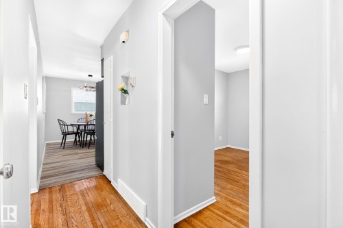 Hardwood flooring extending through the hallway - 16152 110B Avenue Nw, Edmonton, AB - Indoor Photo Showing Other Room