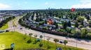 Aerial perspective showcasing a residential neighborhood with tree-lined streets and established homes - 16152 110B Avenue Nw, Edmonton, AB  - Outdoor With View 