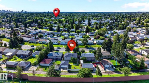 Suburban neighborhood setting with established tree-lined streets and individual residential properties - 16152 110B Avenue Nw, Edmonton, AB - Outdoor With View