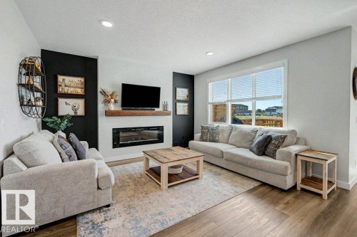 243 Brickyard Cove, Stony Plain, AB - Indoor Photo Showing Living Room With Fireplace